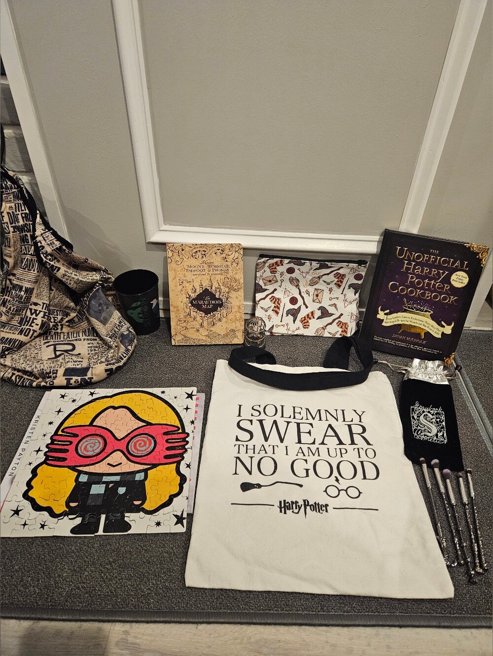 Assorted Harry Potter items. Puzzle, Ornament, Tote Bag, Cookbook, Notebook, Cup